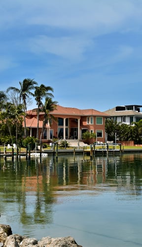 Waterfront homes reflected in a canal