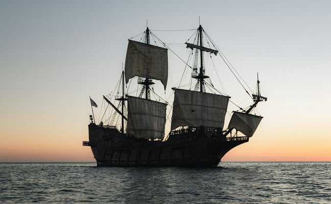 Tall ship silhouette at sunset